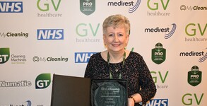 A woman who has dedicated her career to helping keep hospital services running has scooped a national award.